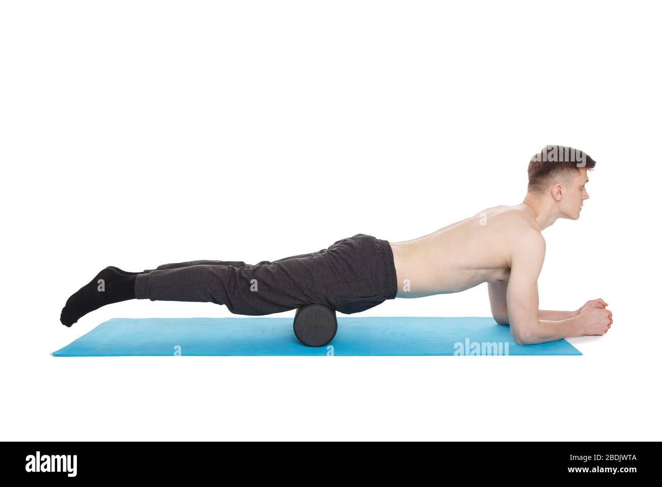 Handsome man shows exercises using a foam roller for a myofascial release  massage of trigger points. Massage of the anterior thigh muscle. Isolated  on Stock Photo - Alamy