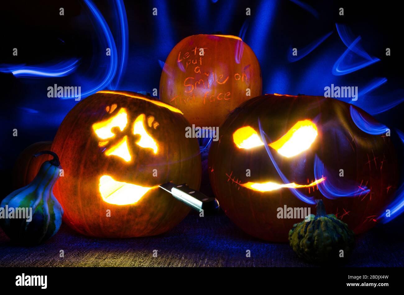 Illuminated Halloween Carved Pumpkins with Light and Knife Stock Photo ...