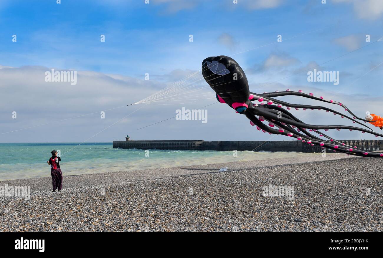 DIEPPE, FRANCE - SEPTEMBER 11, 2018: Kite festival. Octopus kites in the sky in Atlantic ocean Stock Photo