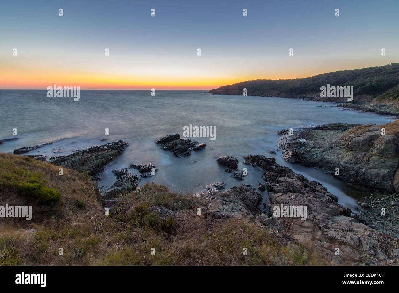 Nice and peaceful sunrise colors by the sea. Stock Photo
