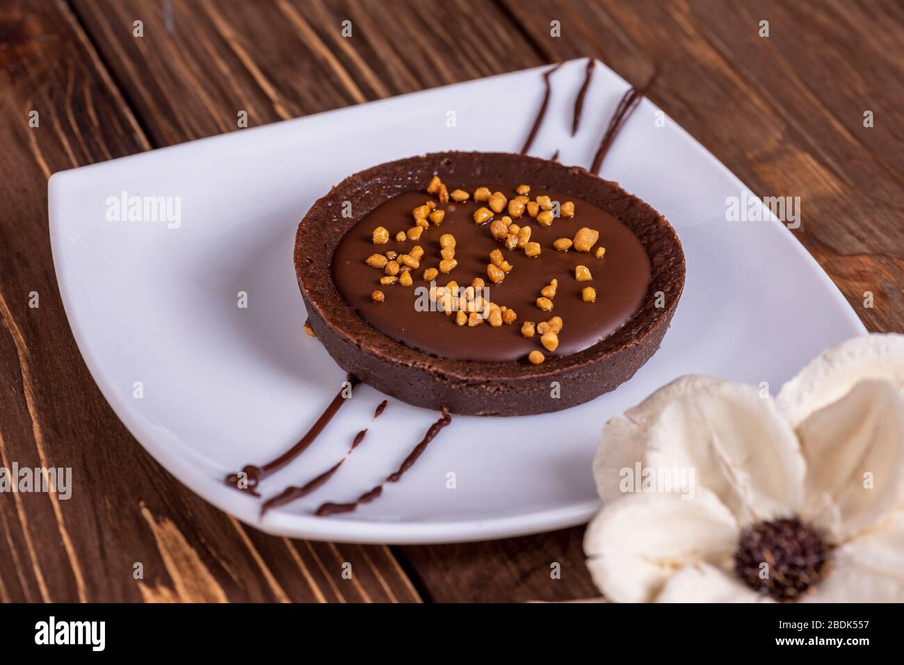 A slice of chocolate cake on table. Stock Photo