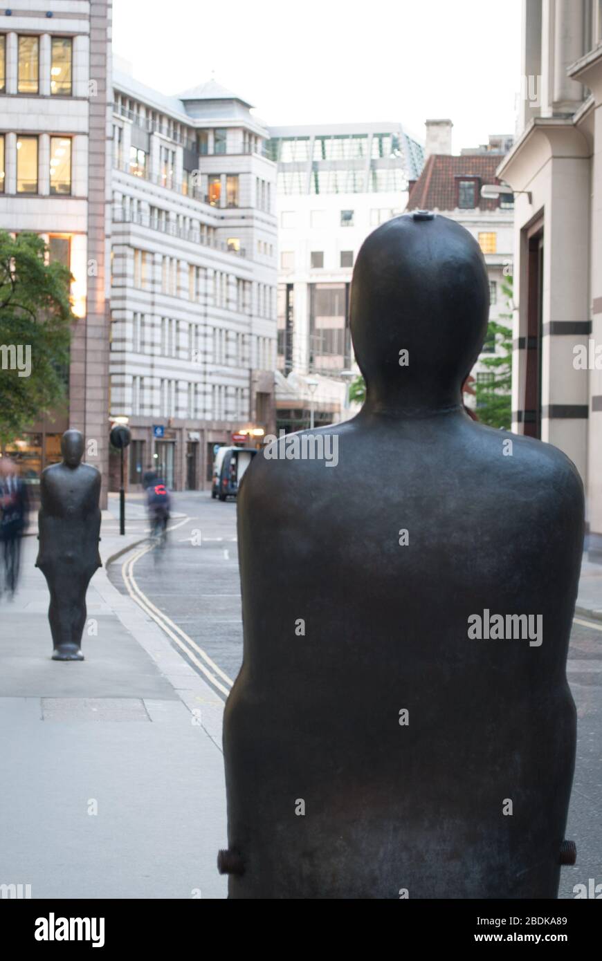 Two Iron Statues Parallel Field Sculpture in the City on St. Mary Axe, City of London EC1 Stock Photo