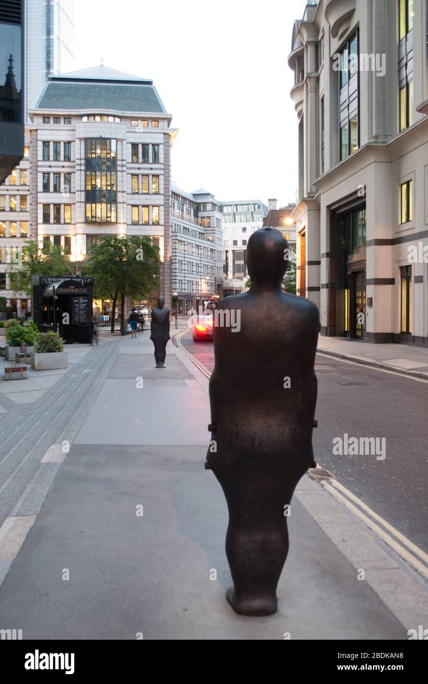Two Iron Statues Parallel Field Sculpture in the City on St. Mary Axe, City of London EC1 Stock Photo