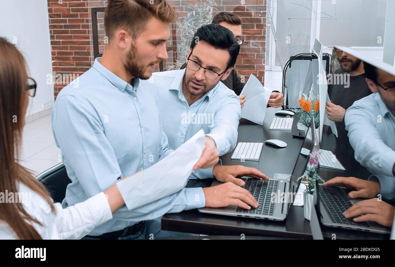employees use computers to work with business documents Stock Photo - Alamy