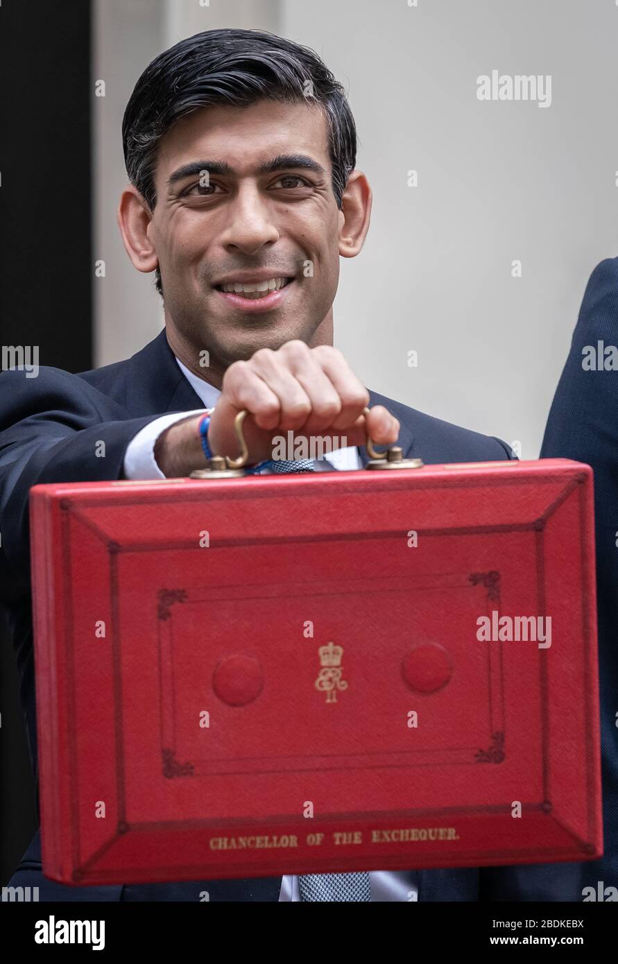 Budget 2020: Chancellor Rishi Sunak poses outside 11 Downing Street with the red Budget box before delivering his first budget statement. London, UK Stock Photo