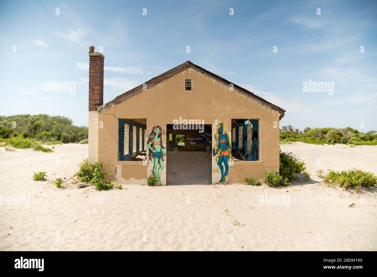 An abandoned beach bungalow with graffiti murals Stock Photo Alamy
