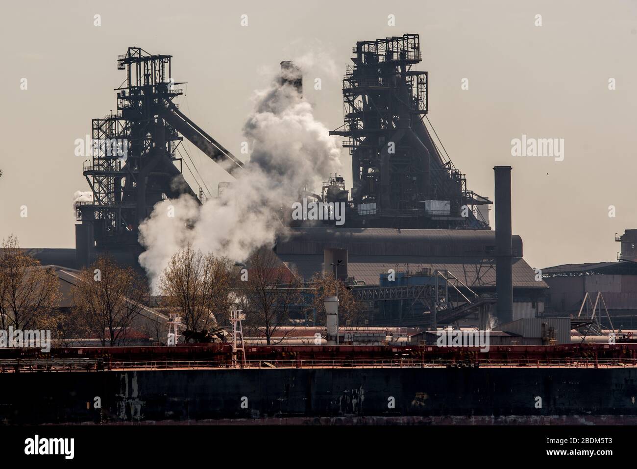 General view of ArcelorMittal in the port of Ghent ArcelorMittal group cuts the production in Europe due to the corona crisis (COVID-19) ArcelorMittal is the world's largest steel producer, Lakshmi Mittal (owner of Mittal Steel) is the chairman and CEO, The company will mainly produce less flat steel. This type of steel is often supplied to automakers, but they shut down their factories in Europe because of the corona virus. Lakshmi N Mittal Assistance relief in Emergency situation in India to stop the coronavirus. (Photo by Jonathan Raa/Pacific Press) Stock Photo