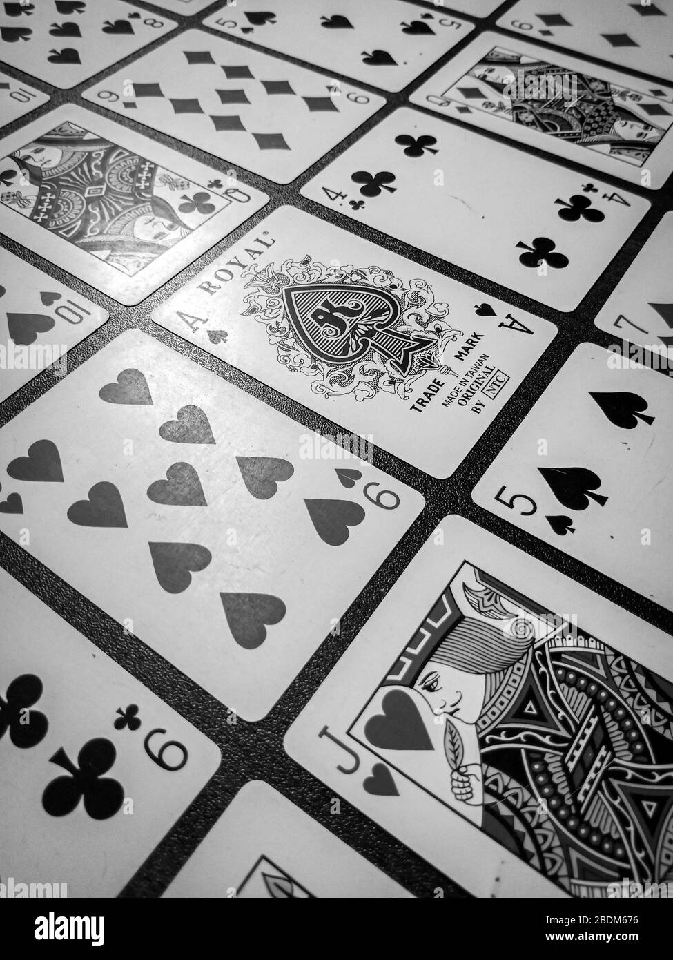 Playing cards in wooden table black and white enjoy your game Stock ...