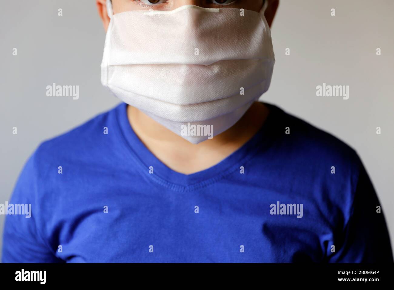 boy wears medical mask for medical treatment and protection Covid-19 coronavirus pollution and respiratory diseases Stock Photo