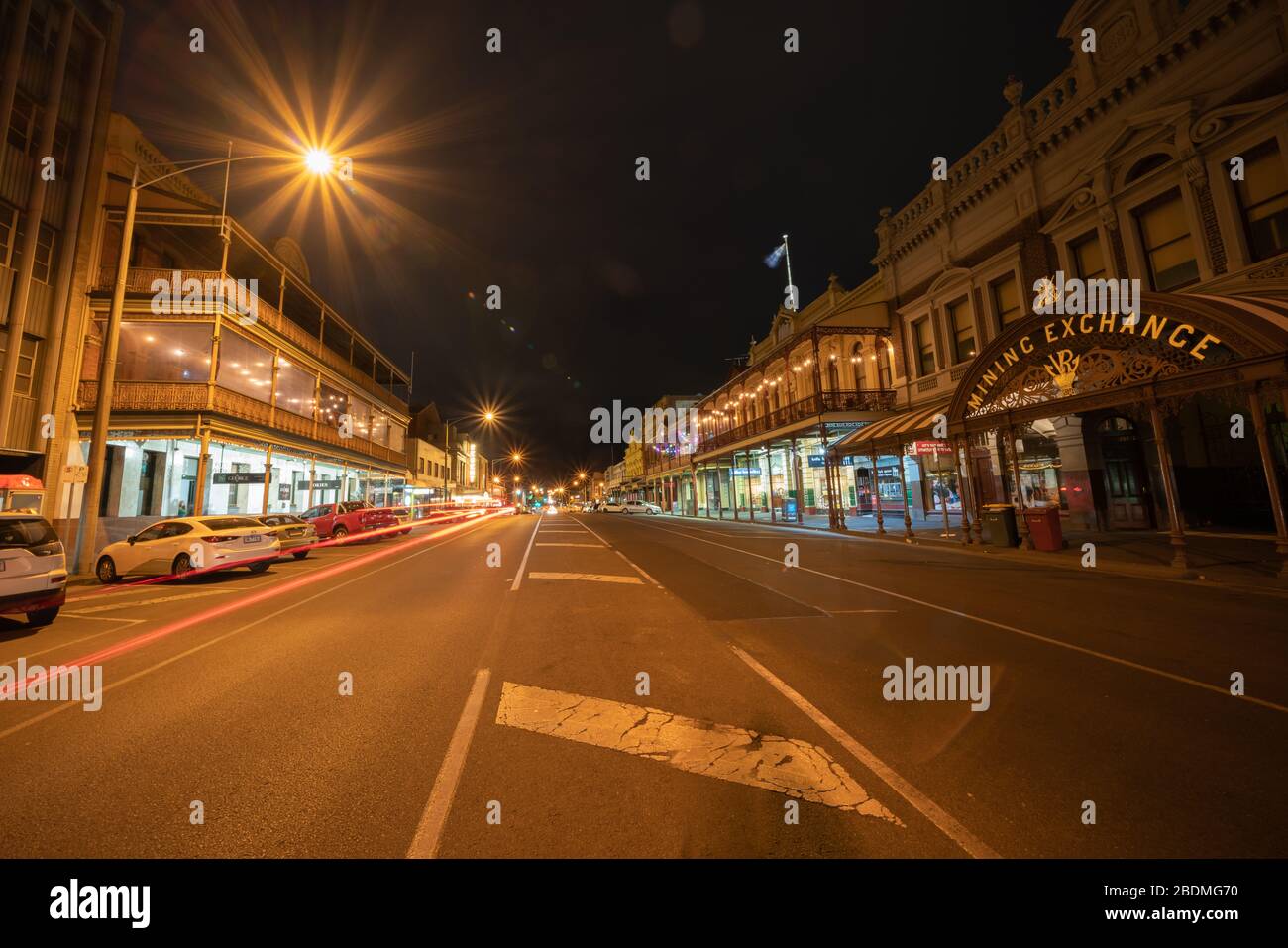 Ballarat Australia - March 15 2020; Wide angle stree view of Mair Street at night  with Mining Exchange building among other Victorian buildings under Stock Photo