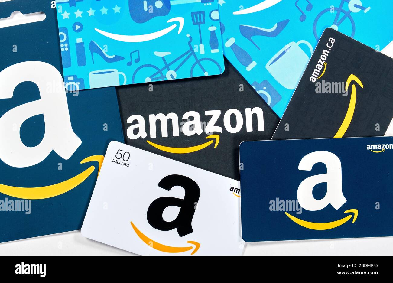 Montreal, Canada - April 6, 2020: Different Amazon gift cards. Amazon is a titan of e-commerce, payments, hardware, data storage, cloud computing, and Stock Photo