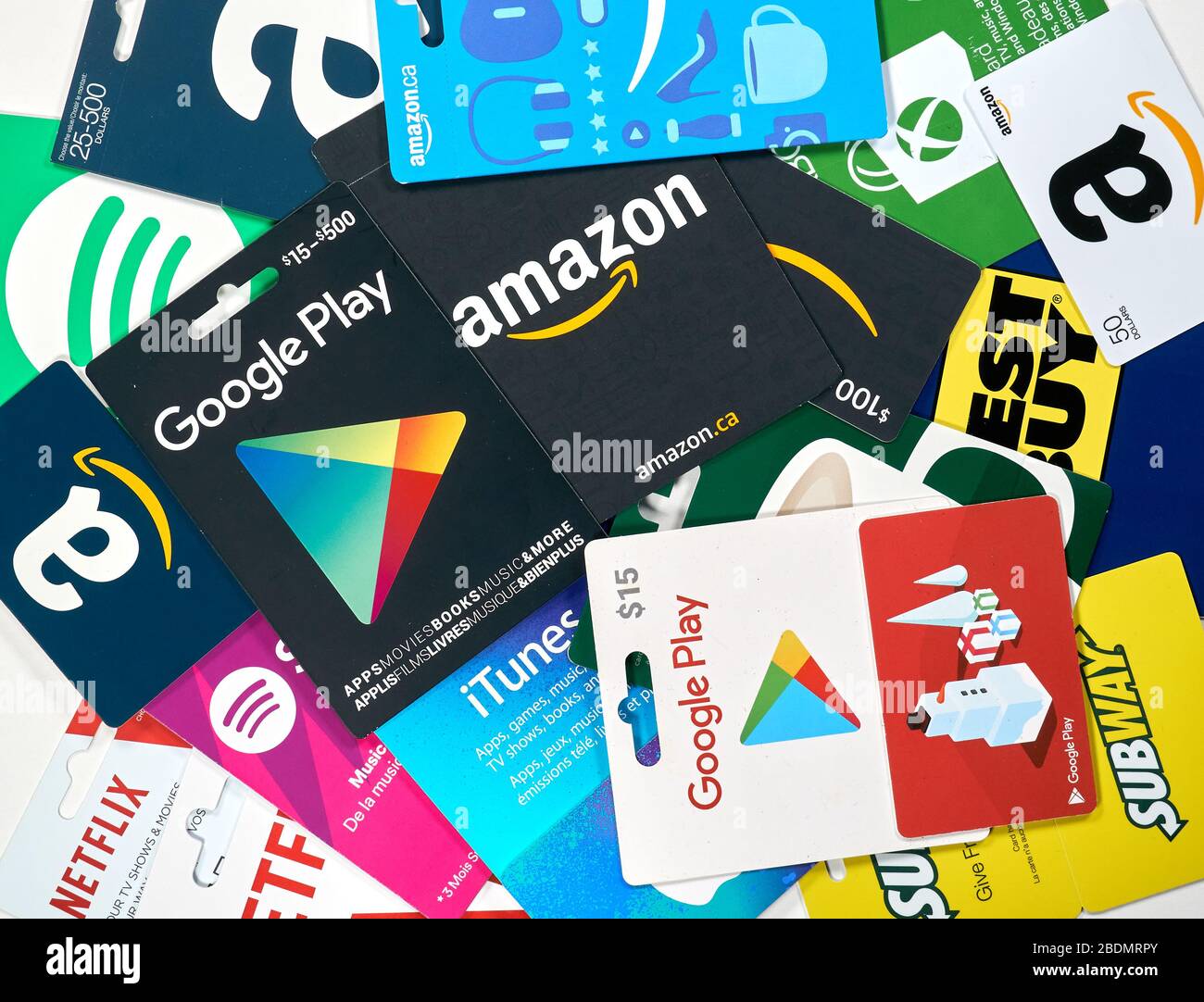Montreal, Canada - April 6, 2020: Different gift cards of many brands such as Amazon, Netflix, Xbox, Google Play, Best Buy, Spotify. A gift card is a Stock Photo