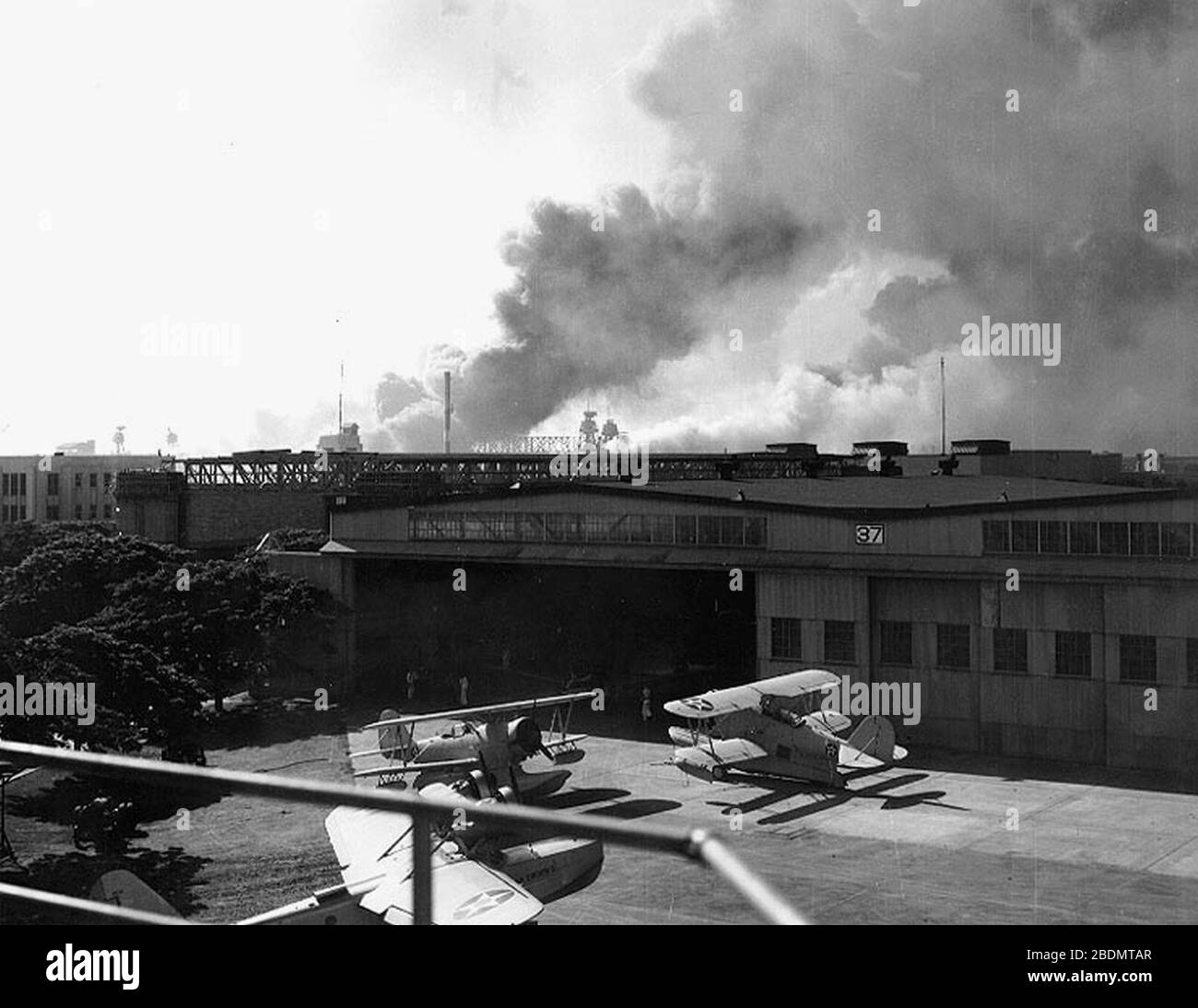 Hangar 37 NAS Ford Island during Pearl Harbor attack 1941. Stock Photo