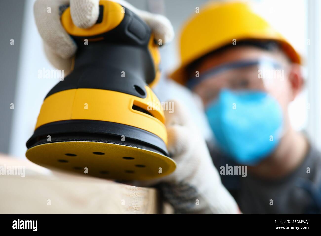 Man in gloves working on renovation Stock Photo