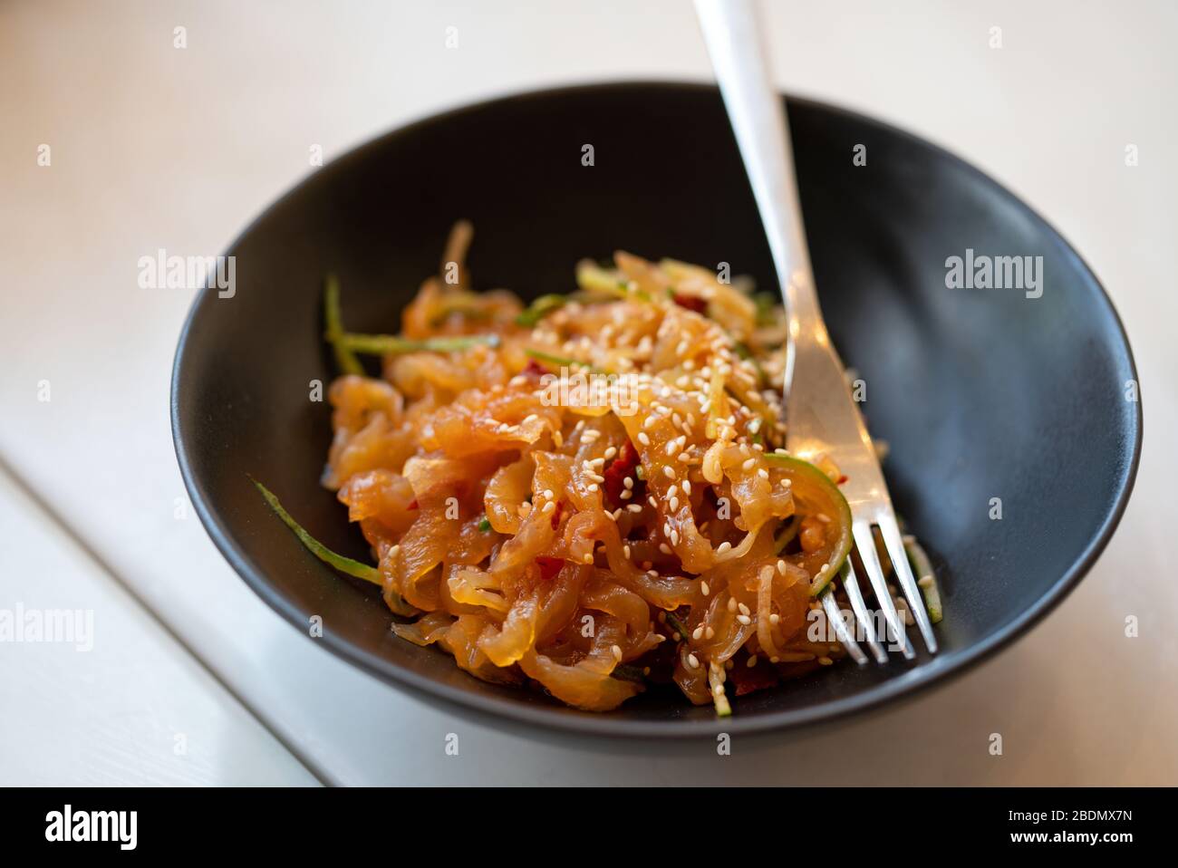 Stir Fried Geoduck Clam in XO Sauce. Chinese seafood served on black