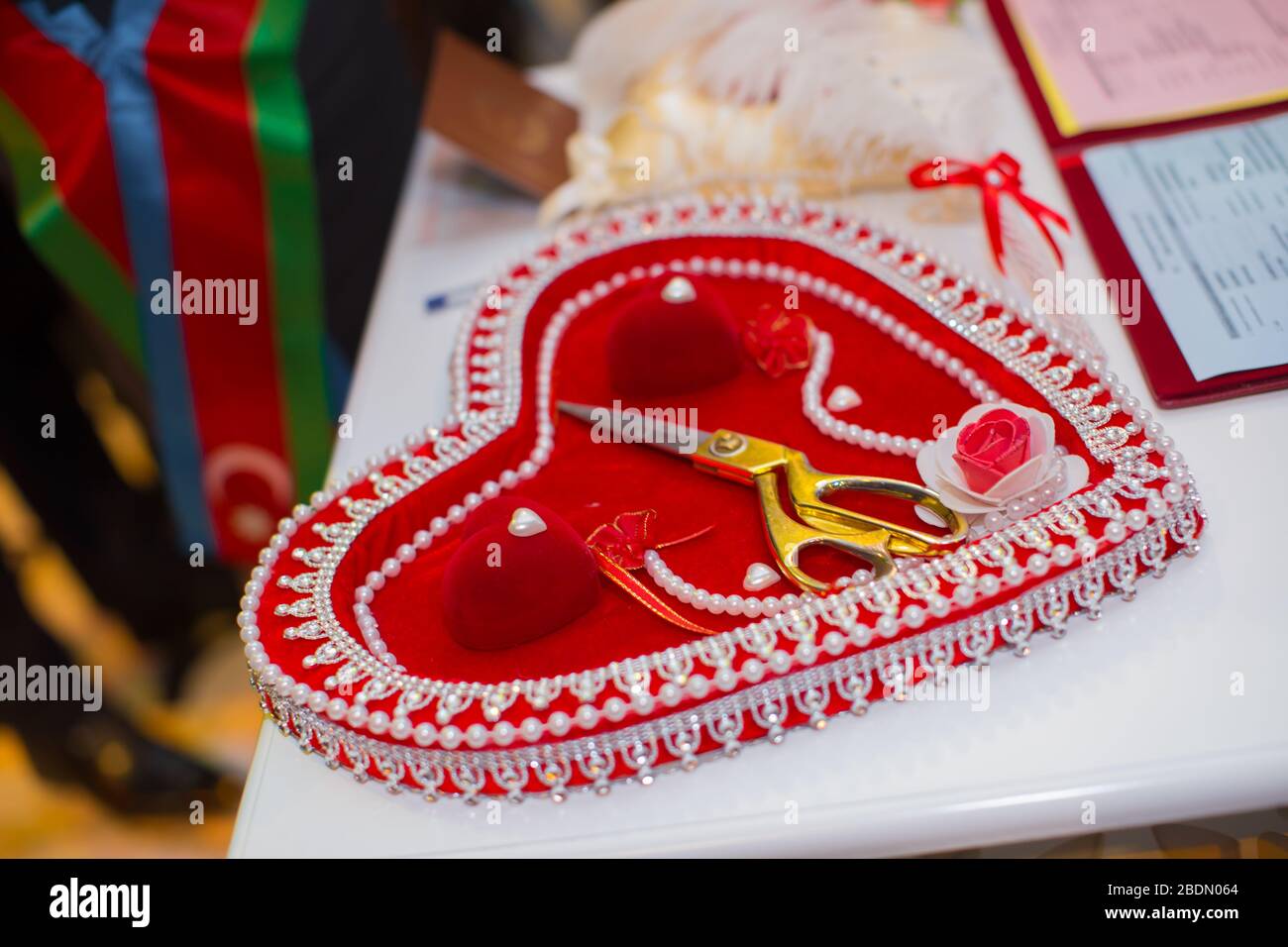 Wedding tradition . Golden rings in a red heart beautiful case . Pearls