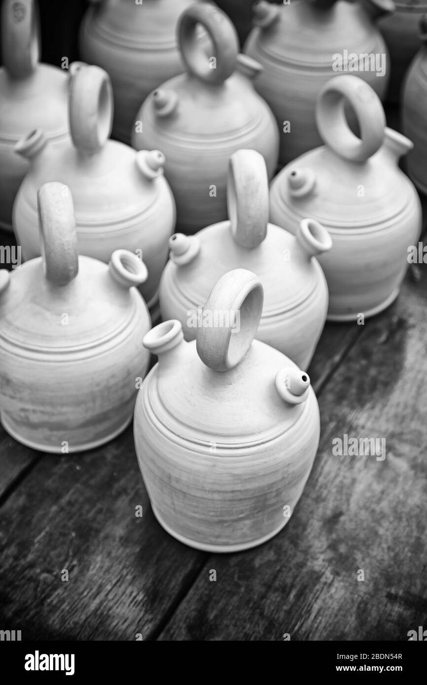 Clay pots, ceramic containers, detail of craftsmanship with mud