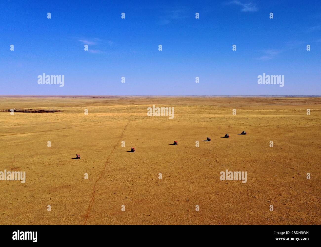 Beijing, China. 7th Apr, 2020. Aerial photo taken on April 7, 2020 shows tractors spraying rodenticide bait on the grassland in Sonid Right Banner, north China's Inner Mongolia Autonomous Region. Credit: Ren Junchuan/Xinhua/Alamy Live News Stock Photo