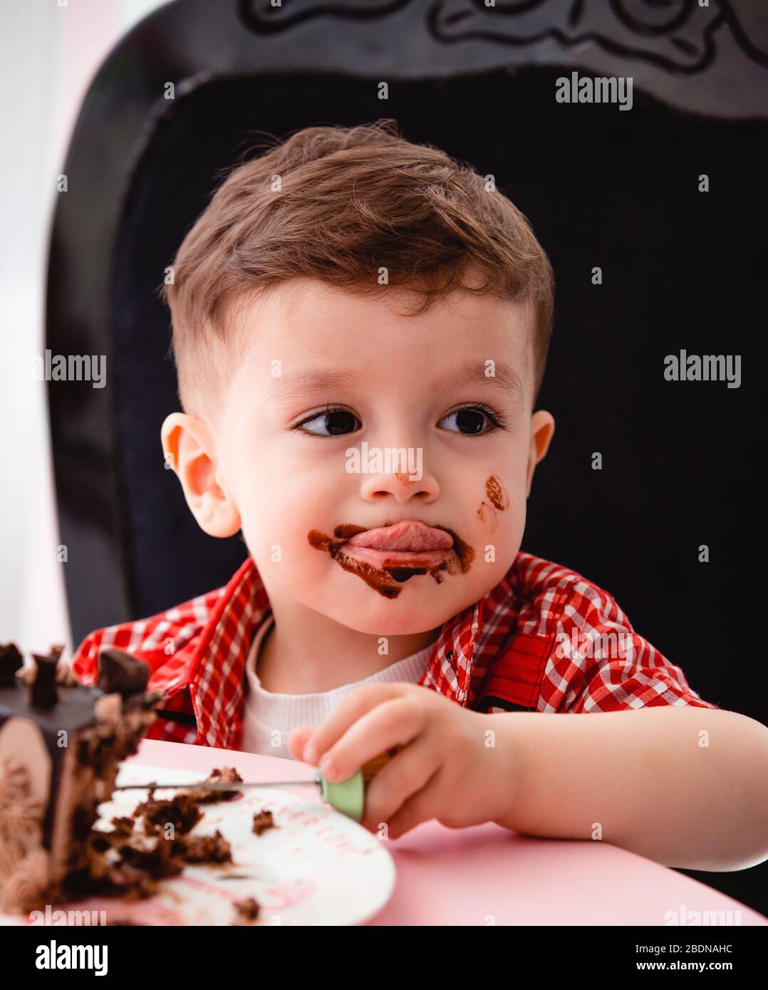little Boy gets little boy eats cake and gets dirty Stock Photo - Alamy