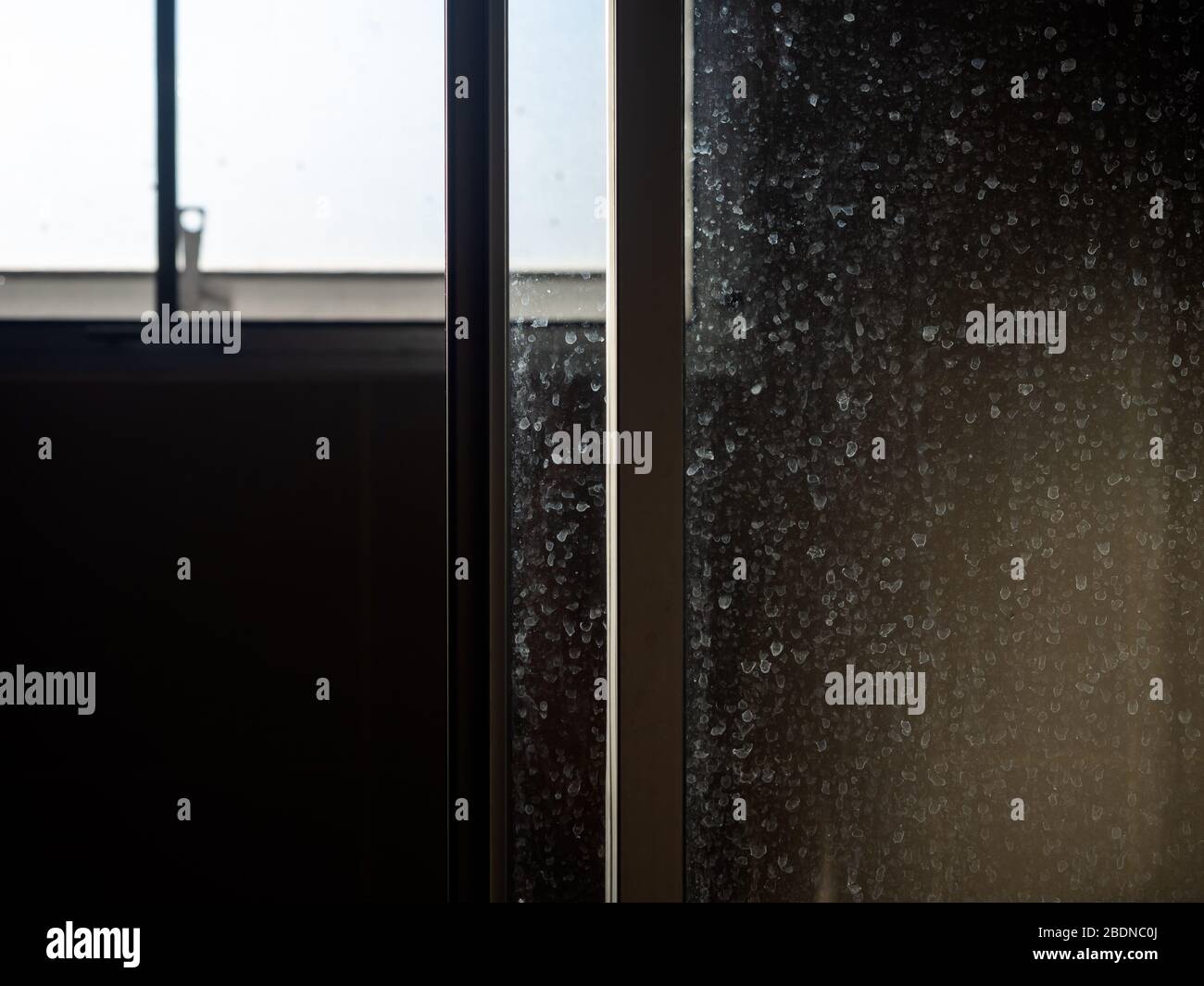 Dusty and dirty glass door. Water stain on sliding door in bathroom