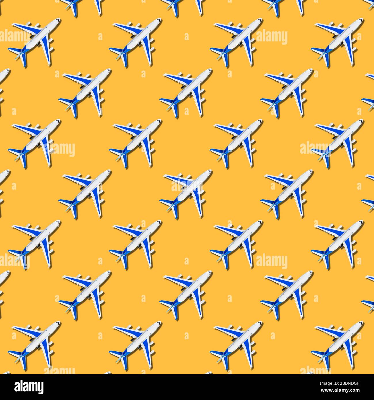 Pattern, seamless model airplane texture, plane on yellow background.  Summer travel or vacation pattern. Creative composition made with passenger  plan Stock Photo - Alamy