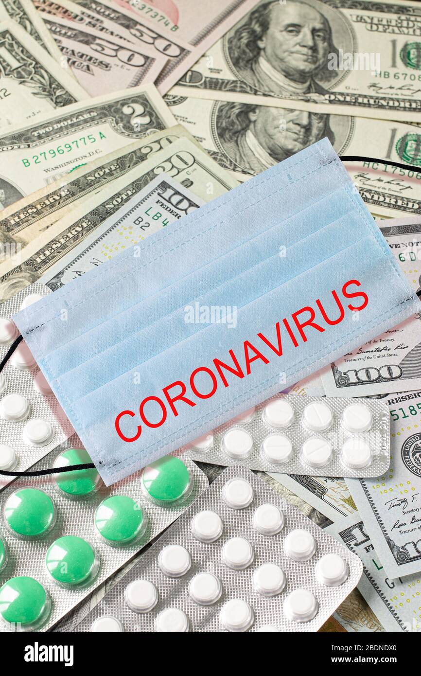 Medical face mask and money. Surgical face mask. COVID-19 has caused a shortage of face masks. Coronavirus quarantine concept. personal protective equ Stock Photo