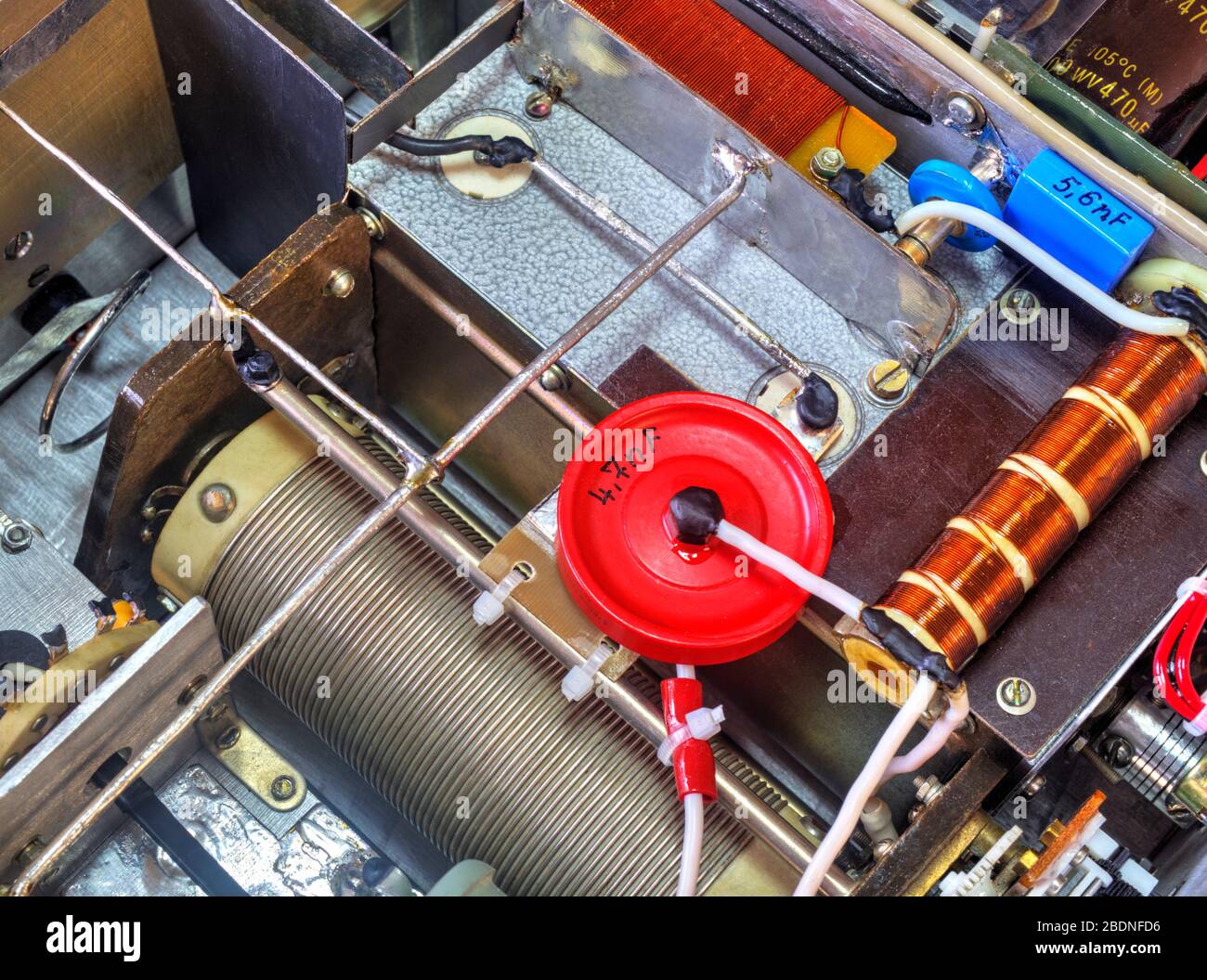 Inside view of high frequency power amplifier with capacitors, coils