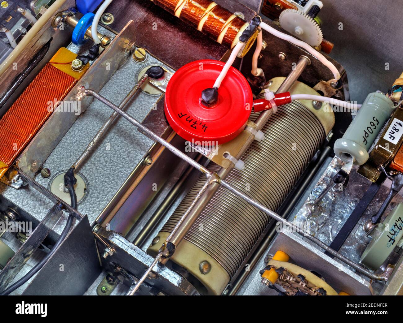 Inside view of high frequency power amplifier with capacitors, coils