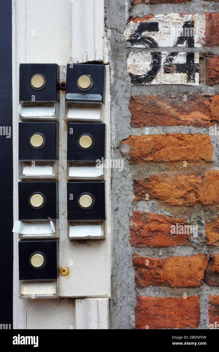 Seven doorbells at a house entrance Stock Photo
