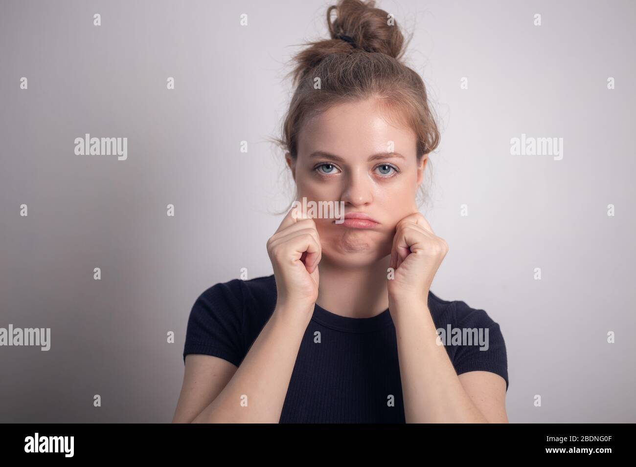 Young caucasian woman girl with double chin and chubby cheeks Stock Photo