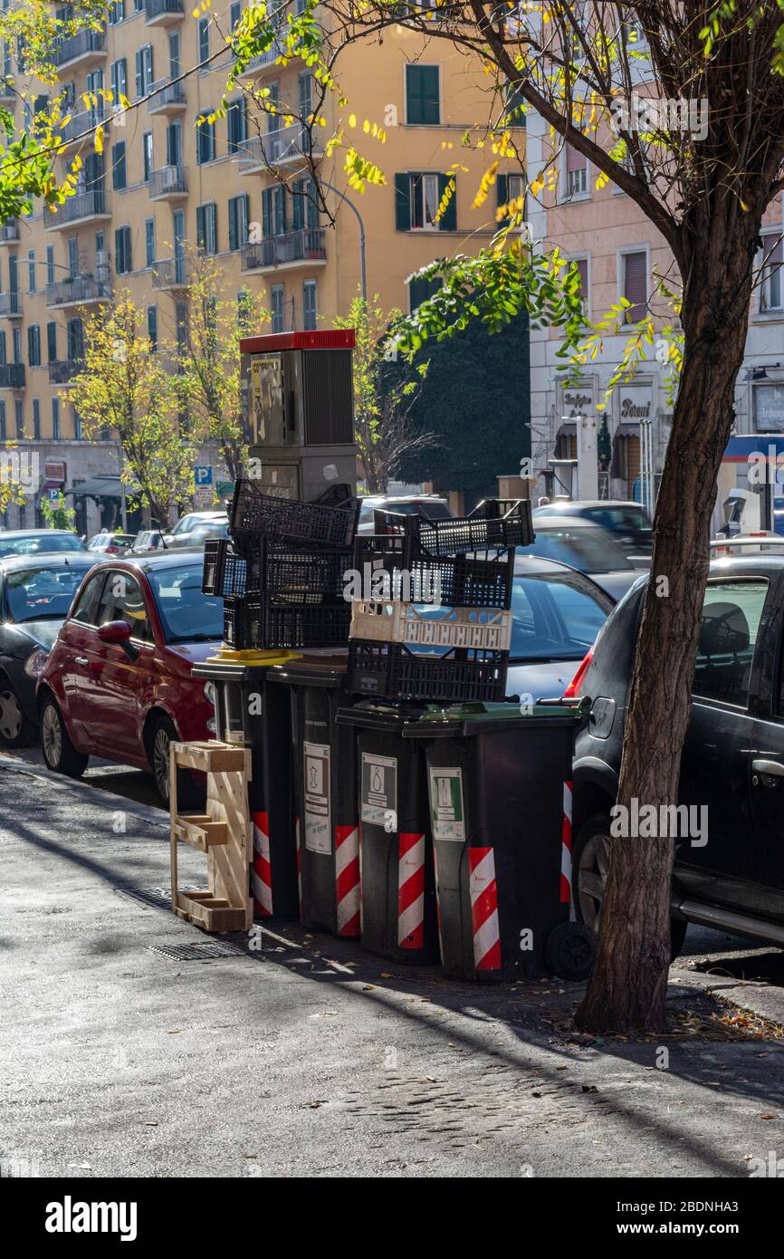 Rome, Italy, 25.12.2019: garbage box near the road downtown, a place for garbage in the city center. Centre Rome, Italy Stock Photo