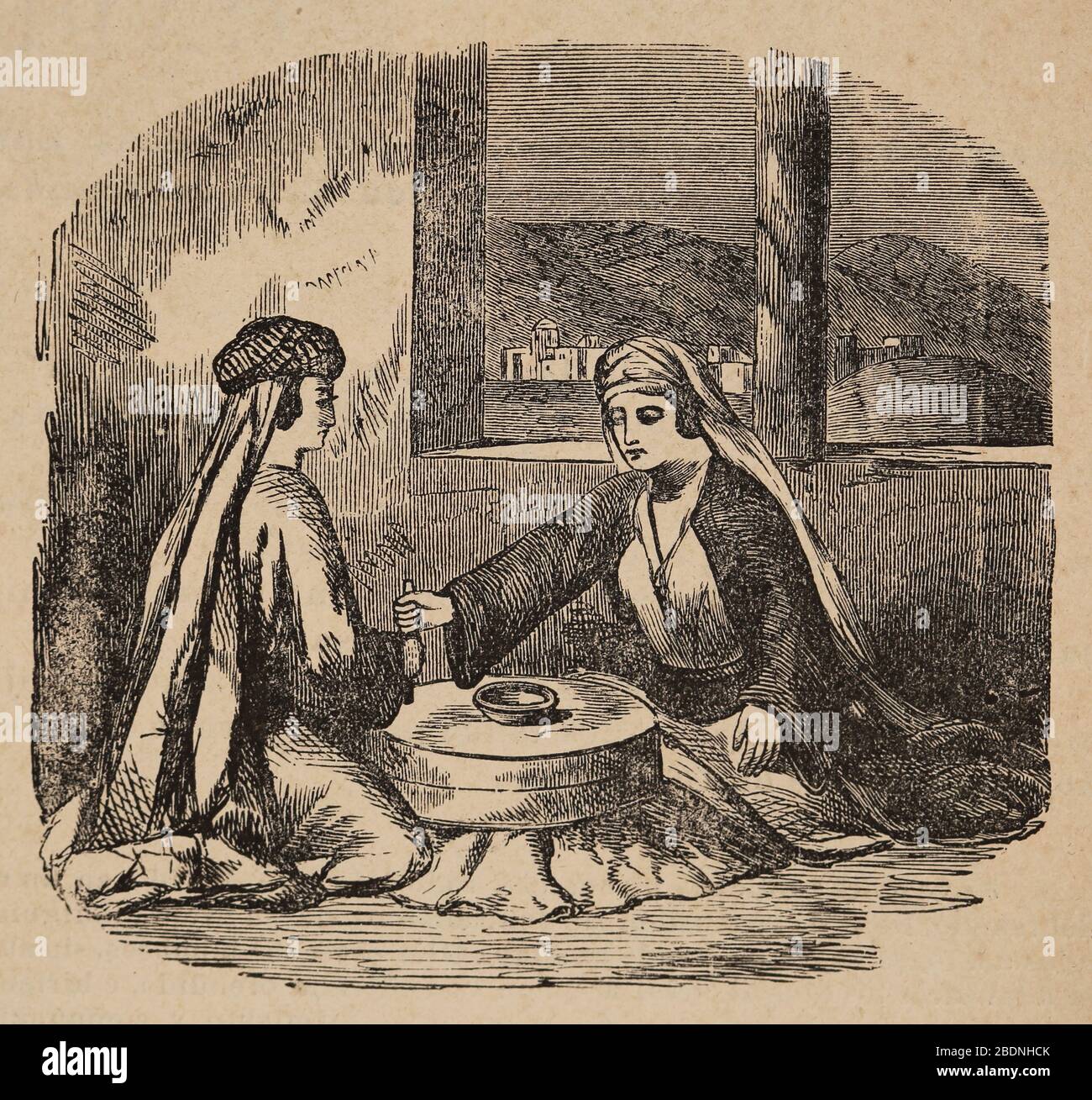 Women grinding grain with rotary hand quern. Engraving, 19th century. Stock Photo