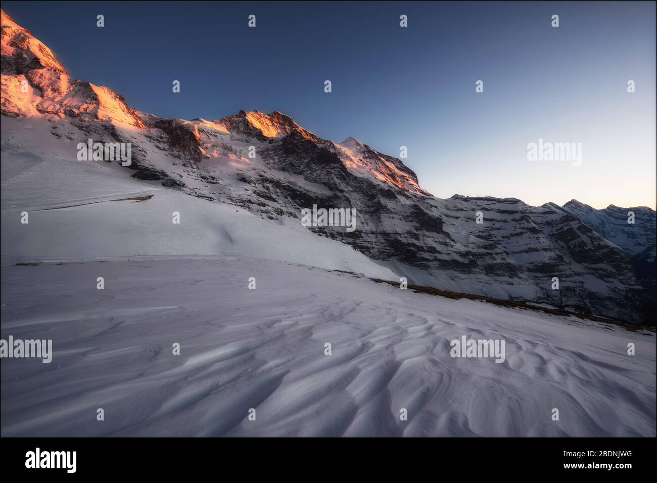 Afterglow at Jungfrau & Silberhorn in the Bernese Alps in Switzerland Stock Photo