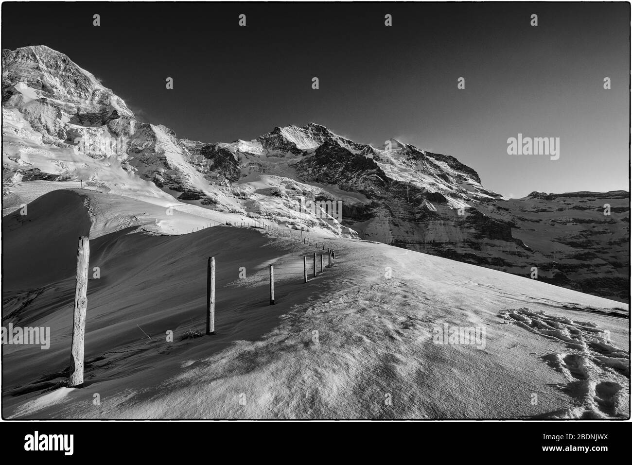 Black and white winter shot of Mönch and Jungfrau in the Bernese Alps Stock Photo