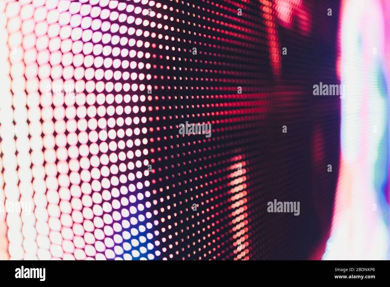 Bright colored blue LED wall with pink pattern - close up background Stock Photo