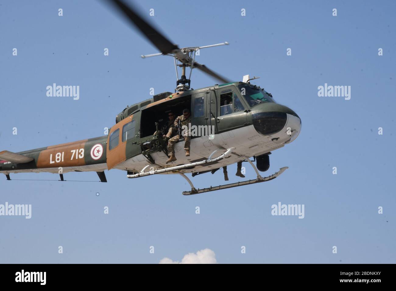 Tunis. 8th Apr, 2020. Photo taken on April 8, 2020 shows Tunisian soldiers patrolling by helicopter to maintain security during the COVID-19 outbreak, in Tunis, Tunisia. In order to contain the spread of the COVID-19 infections, Tunisian government has suspended most of commercial and cultural activities, called on people to stay home and imposed curfews in various cities. Credit: Adele Ezzine/Xinhua/Alamy Live News Stock Photo