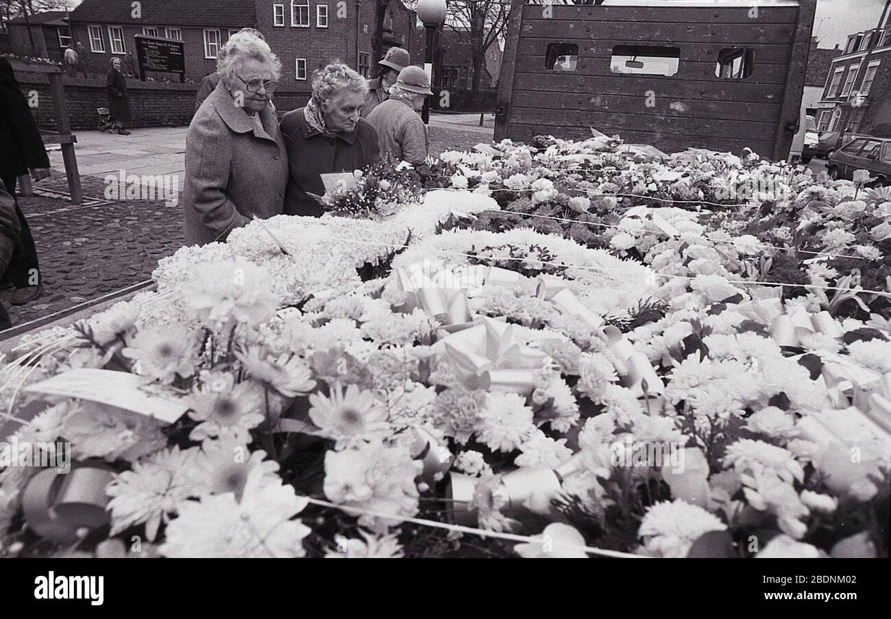 1980s, historical, two ladies looking at the large number of flowers or