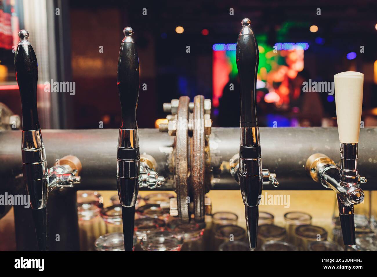 The bar counter with bottles and apparatus for dispensing beer