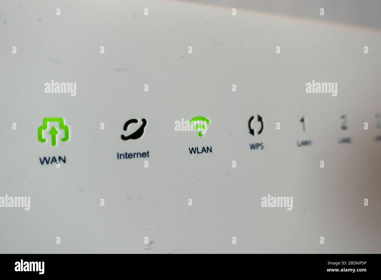 Extreme closeup shot of green lights of connection on modem