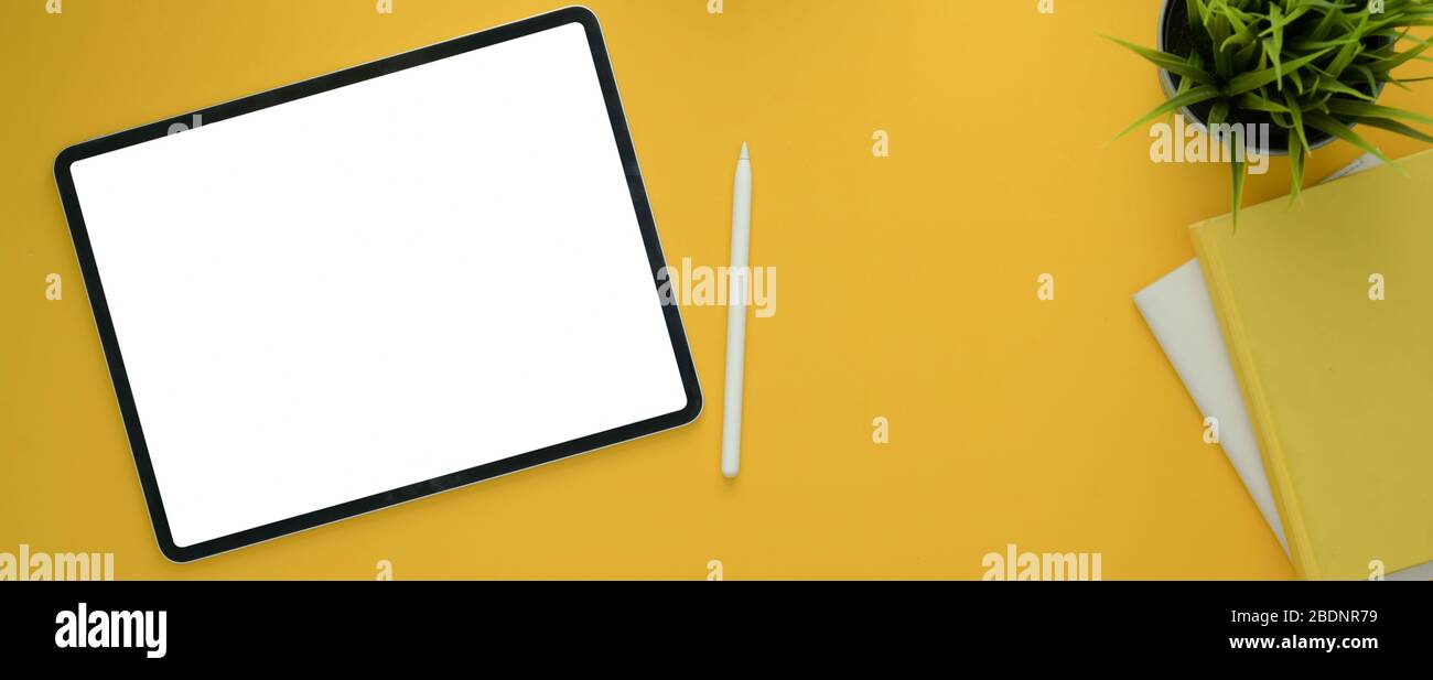 Download Top View Of Creative Workspace With Mock Up Tablet Diary Notebooks And Decoration On Yellow Table Background Stock Photo Alamy PSD Mockup Templates