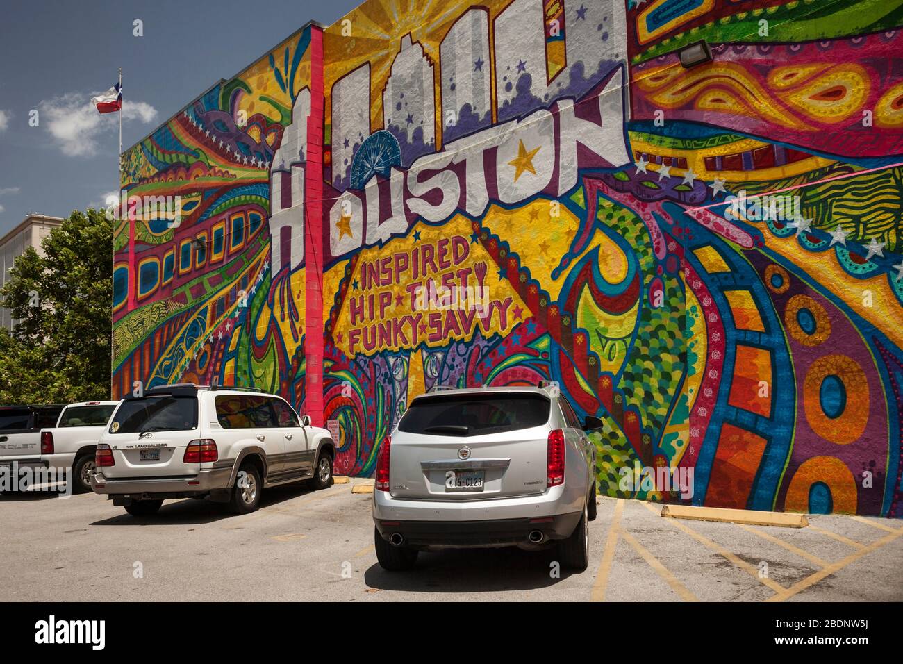 Slanted view of a colorful mural dedicated to Houston in a parking lot