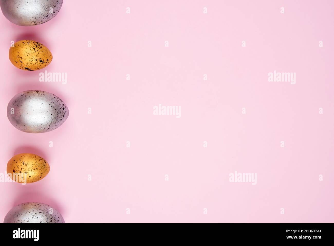 Beautiful easter eggs on a pink background. Stock Photo