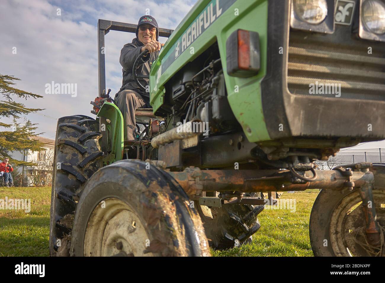 Farmer on the tractor Stock Photo - Alamy