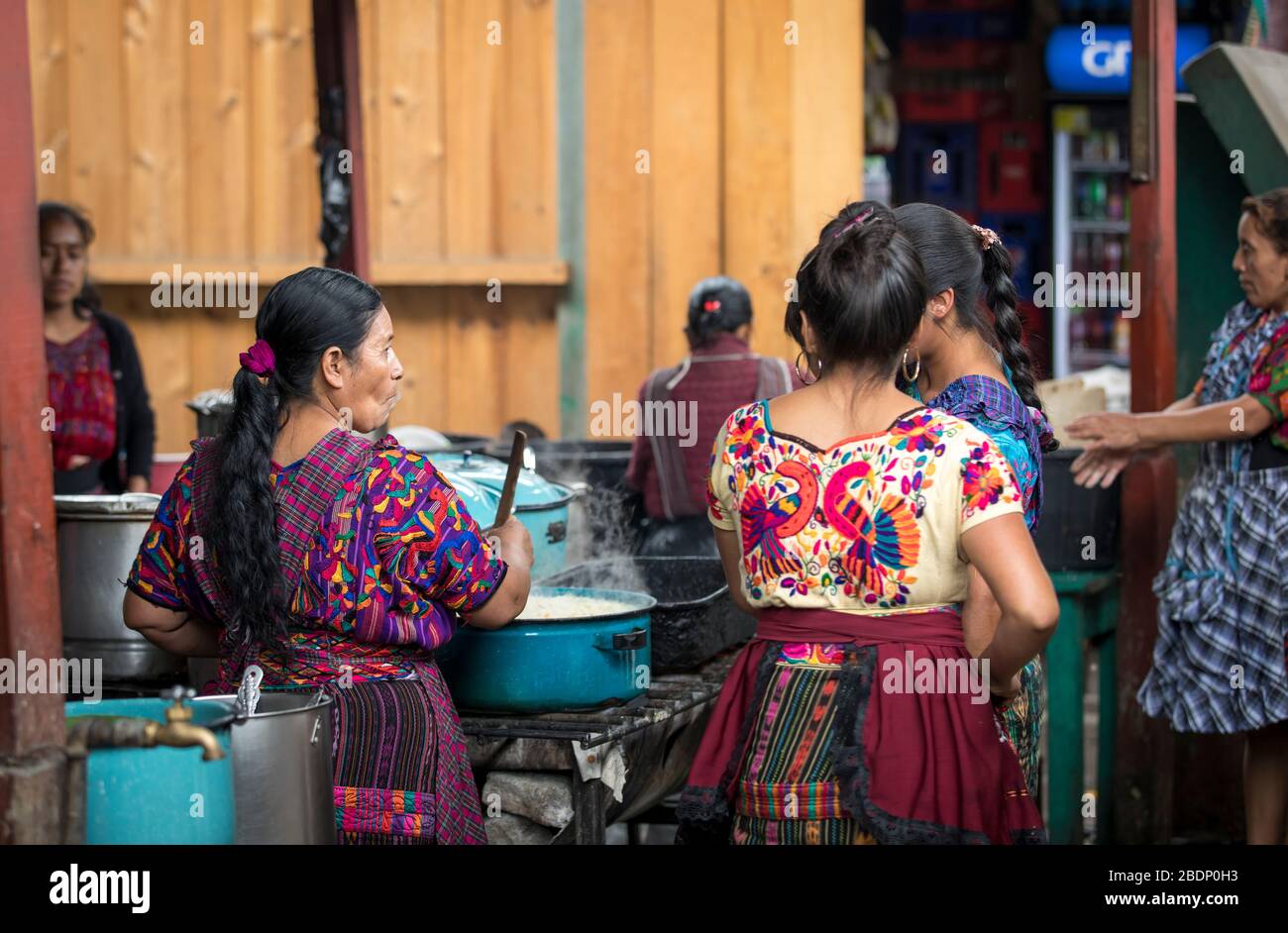 chichicastenango, Guatemala, 27th February 2020: mayan women cooking at the traditional market Stock Photo