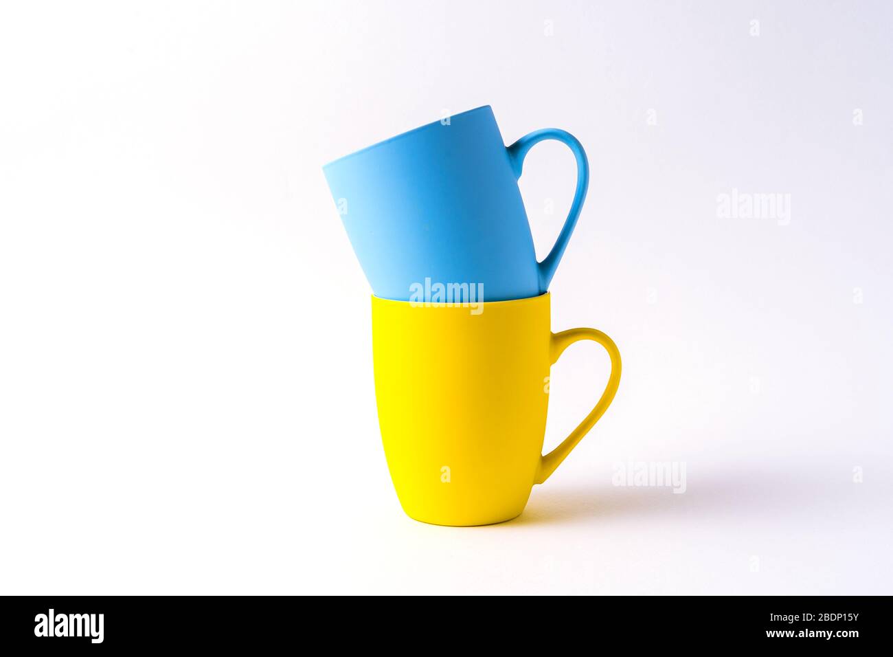 Stack with mugs isolated on white background, front view. Stock Photo