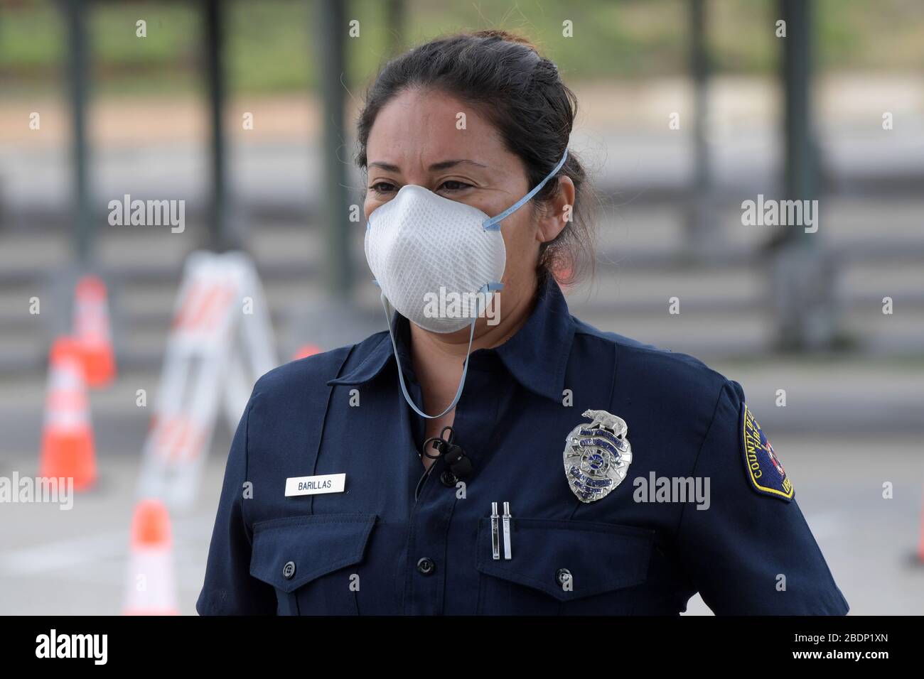 CALIFORNIA, USA. 08th Apr, 2020. LA County Fire Department Lifeguard public information officer Lydia Barillas wears a face mask at coronavirus drive-thru testing site at East Los Angeles College amid the global coronavirus COVID-19 pandemic, Wednesday, April 8, 2020, in Monterey Park, Califronia, USA. (Photo by IOS/Espa-Images) Credit: European Sports Photo Agency/Alamy Live News Stock Photo