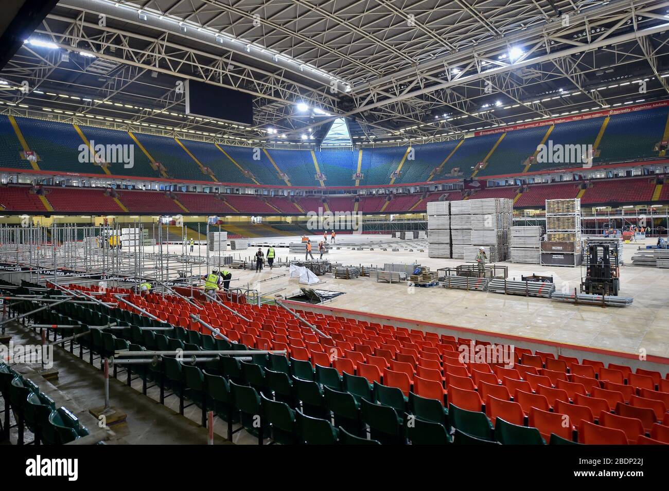 No grass can be seen as a floor is laid inside the Principality Stadium, Cardiff, which is being turned into a 2000-bed hospital to help fight coronavirus. Stock Photo