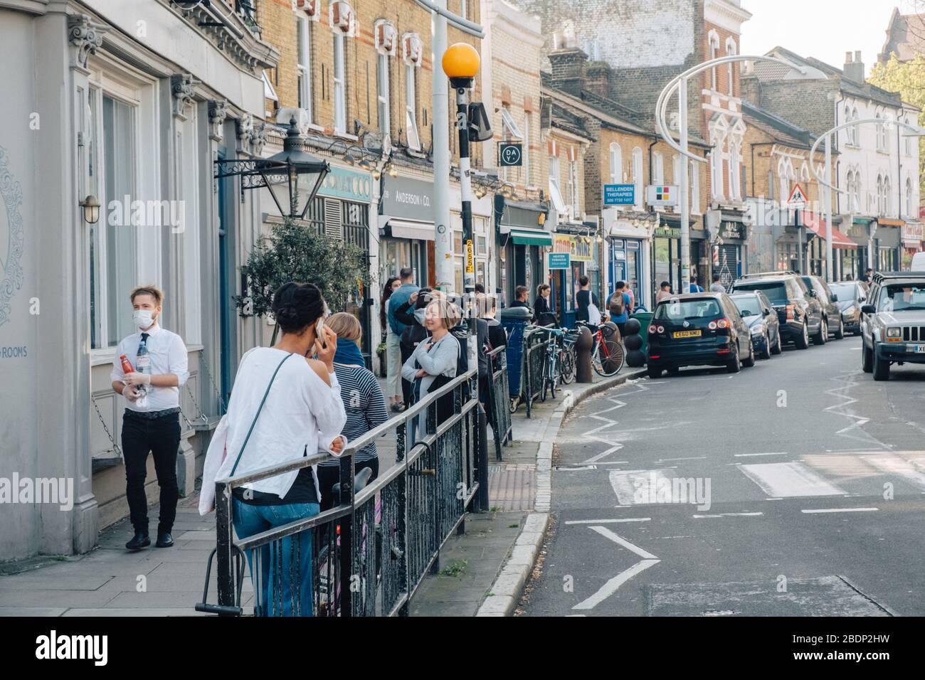 Bellenden Road, Peckam, London, UK. 9th Apr, 2020. Shoppers queue
