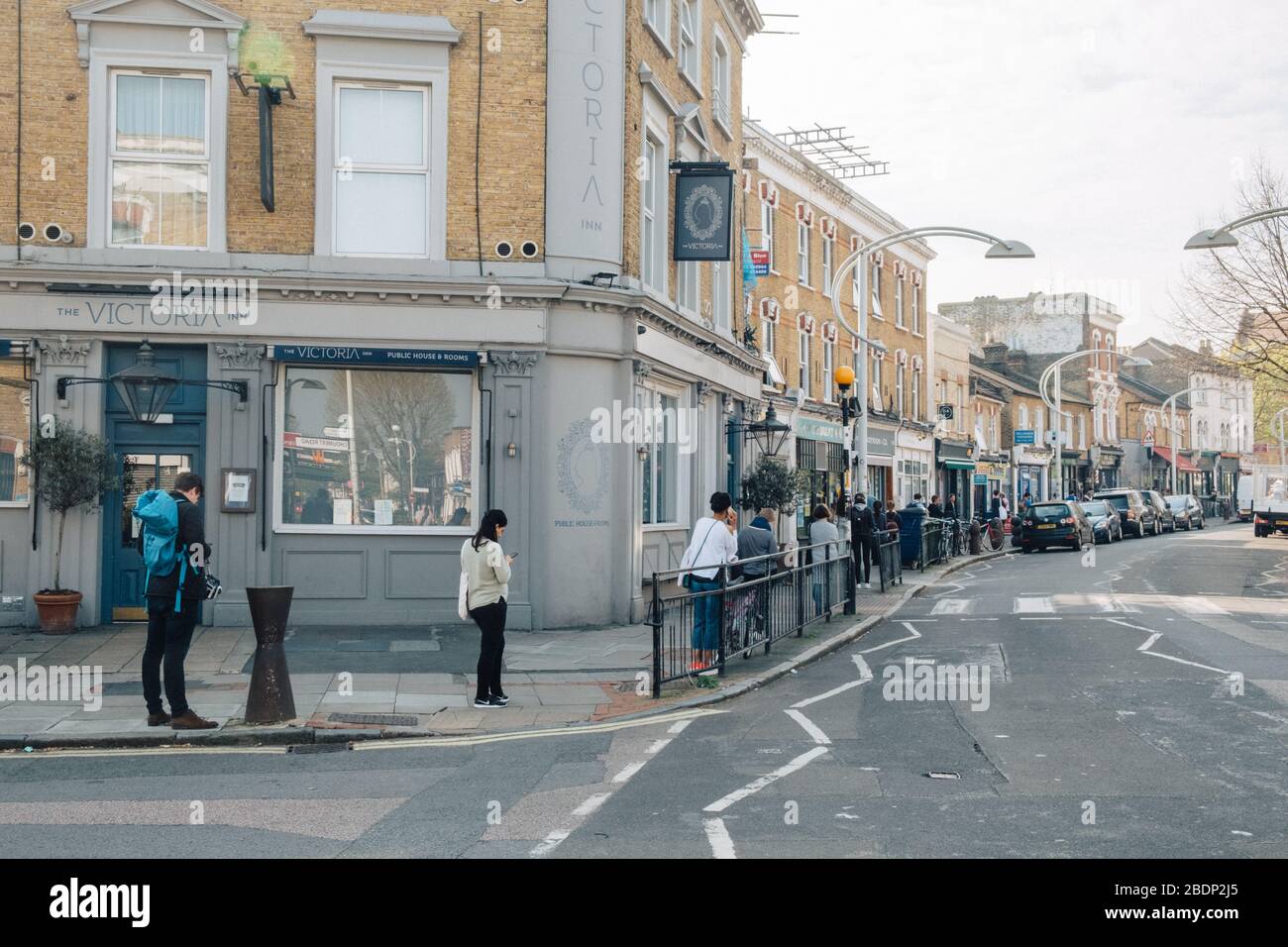 Bellenden Road, Peckam, London, UK. 9th Apr, 2020. Shoppers queue around the block for over an