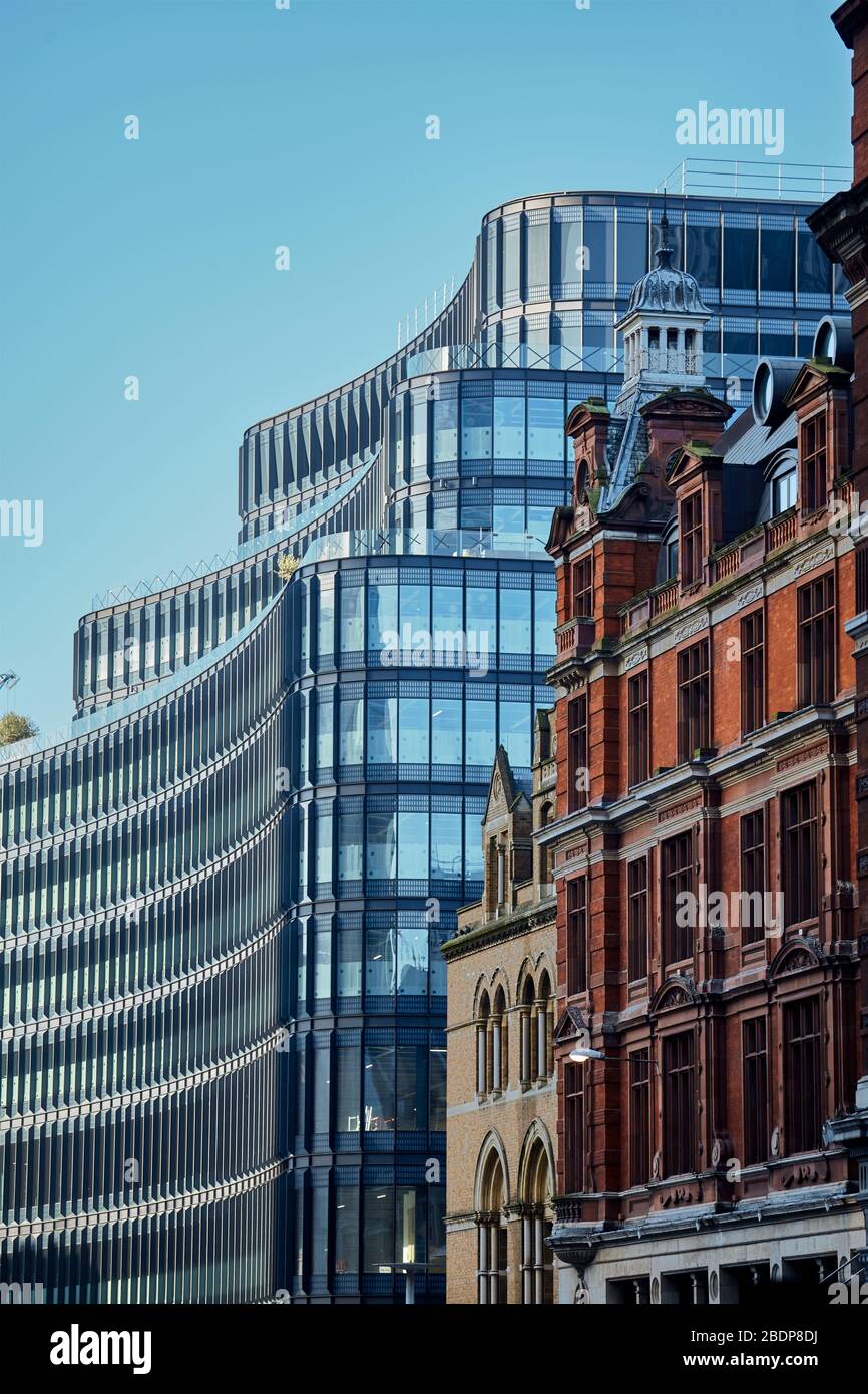 100 Liverpool Street building by Hopkins Architects next to the historic building of Liverpool street train station. Stock Photo